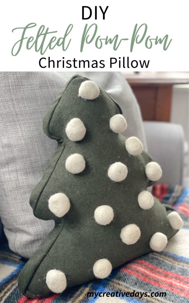 Looking for a cute Christmas pillow? Make a DIY Felted Pom-Pom Christmas Pillow on the cheap without any sewing and only a few supplies!