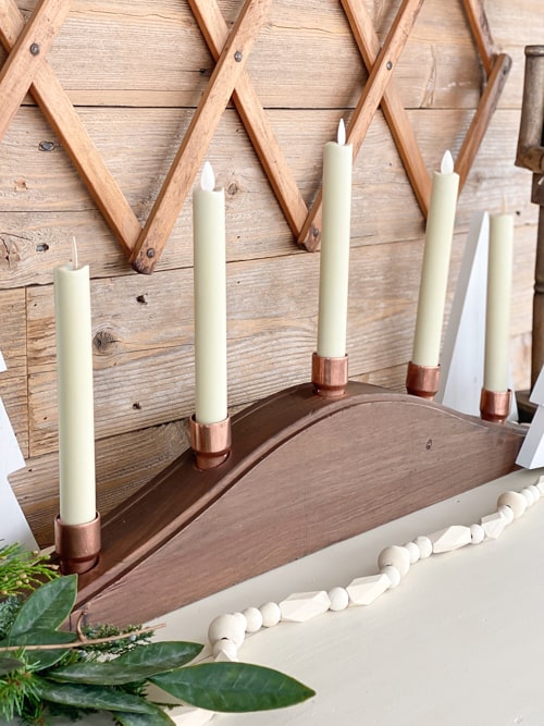 This DIY Wood Tapered Candle Holder is a unique way to display your favorite flameless tapered and pillar candles in your home.