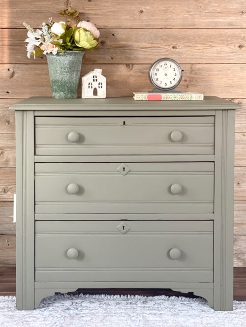 This olive green dresser makeover will show you how easy it is to transform an old piece of furniture with all-in-one paint and a sander.