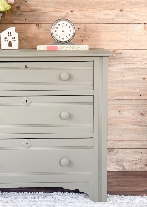 This olive green dresser makeover will show you how easy it is to transform an old piece of furniture with all-in-one paint and a sander.