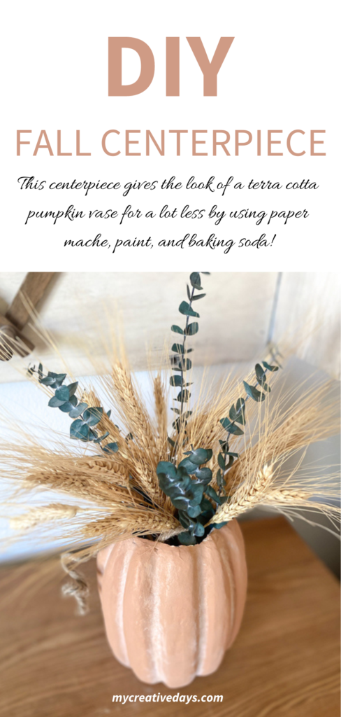 This DIY Fall Centerpiece gives the look of a terra cotta pumpkin vase for a lot less by using paper mache, paint, and baking soda!