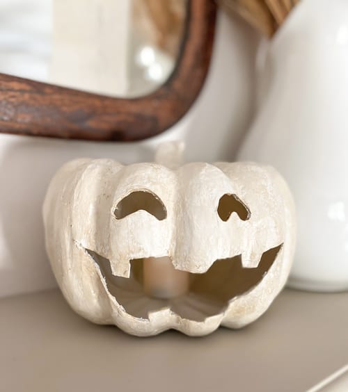 This DIY Jack-O-Lantern Tealight Holder is an easy project that will give you the look of an expensive holder for a fraction of the cost.