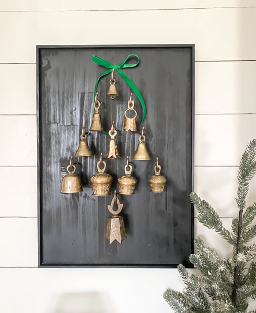 This DIY Bell Christmas Tree Display tutorial is a step-by-step guide on how to craft a whimsical tree adorned with antique bells. 