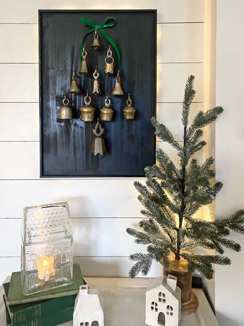 This DIY Bell Christmas Tree Display tutorial is a step-by-step guide on how to craft a whimsical tree adorned with antique bells. 