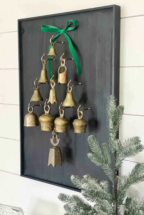 This DIY Bell Christmas Tree Display tutorial is a step-by-step guide on how to craft a whimsical tree adorned with antique bells. 