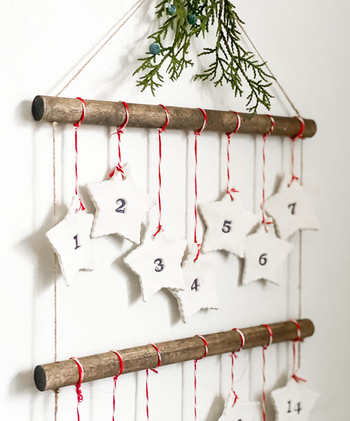 Discover how to make this DIY Scandinavian Advent Calendar with this step-by-step tutorial! It is easy and the kids can help you make it!