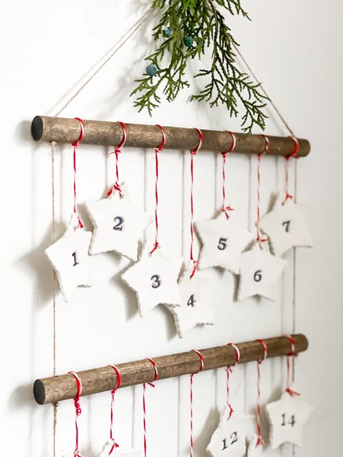 Discover how to make this DIY Scandinavian Advent Calendar with this step-by-step tutorial! It is easy and the kids can help you make it!