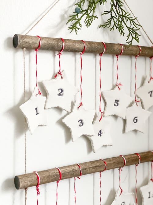 Discover how to make this DIY Scandinavian Advent Calendar with this step-by-step tutorial! It is easy and the kids can help you make it!