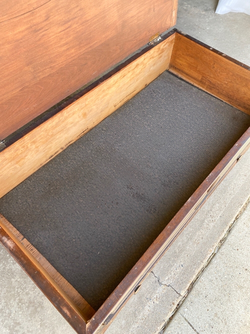 An Antique Coffee Table Makeover tutorial that will show you how to transform an old piece with sanding, painting, and staining for a stunning transformation.