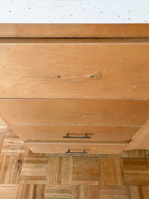 Affordable kitchen cabinets and countertops from CKF transformed our flip kitchen. See our design process, finishes, and budget-friendly tips!