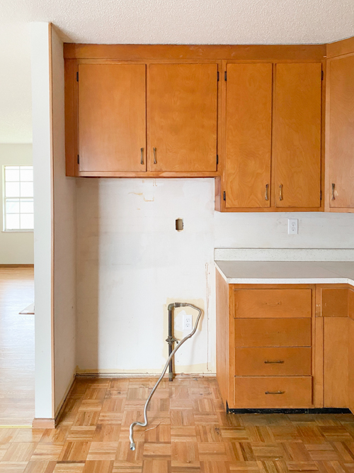 Affordable kitchen cabinets and countertops from CKF transformed our flip kitchen. See our design process, finishes, and budget-friendly tips!