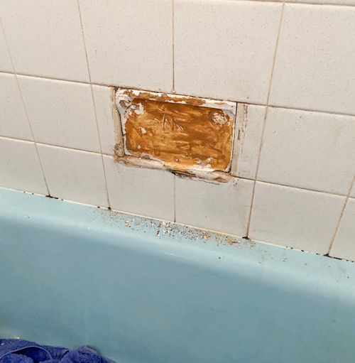 Transform your bathroom with a budget shower tile makeover without demolition. Easy DIY project with lasting results using our favorite paint kit.