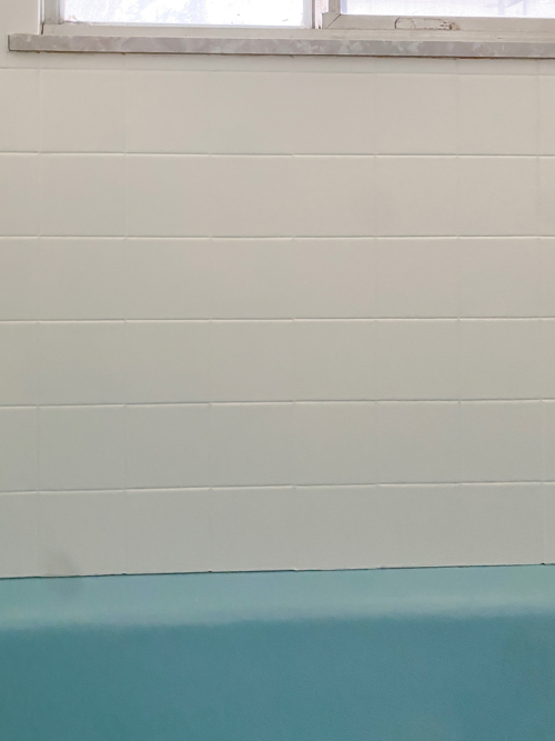 Transform your bathroom with a budget shower tile makeover without demolition. Easy DIY project with lasting results using our favorite paint kit.