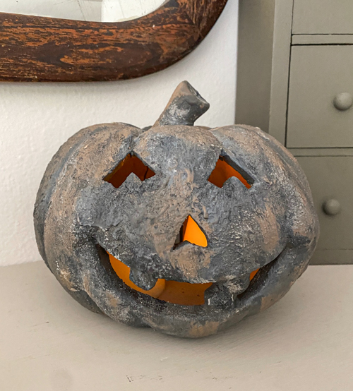 Create a DIY Black Terracotta Jack O’ Lantern Pottery Barn dupe for a fraction of the cost. Easy thrift flip tutorial with supplies and video tutorial.