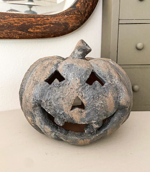 Create a DIY Black Terracotta Jack O’ Lantern Pottery Barn dupe for a fraction of the cost. Easy thrift flip tutorial with supplies and video tutorial.