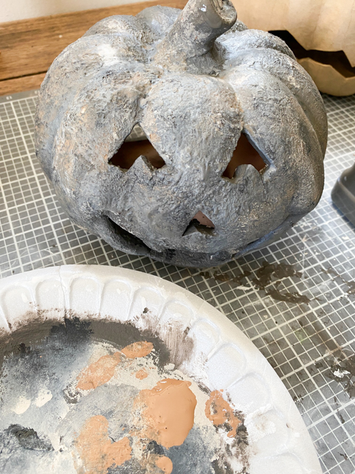 Create a DIY Black Terracotta Jack O’ Lantern Pottery Barn dupe for a fraction of the cost. Easy thrift flip tutorial with supplies and video tutorial.