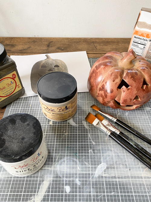 Create a DIY Black Terracotta Jack O’ Lantern Pottery Barn dupe for a fraction of the cost. Easy thrift flip tutorial with supplies and video tutorial.