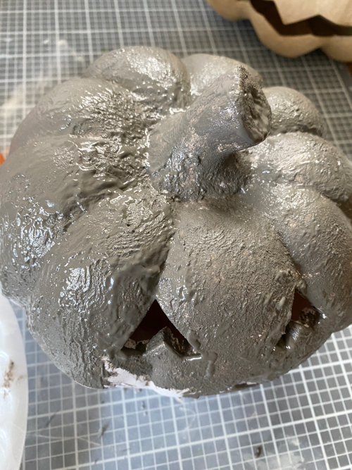 Create a DIY Black Terracotta Jack O’ Lantern Pottery Barn dupe for a fraction of the cost. Easy thrift flip tutorial with supplies and video tutorial.