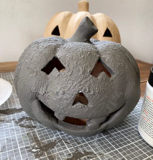 Create a DIY Black Terracotta Jack O’ Lantern Pottery Barn dupe for a fraction of the cost. Easy thrift flip tutorial with supplies and video tutorial.