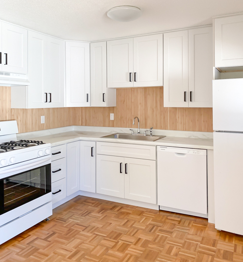 Affordable kitchen cabinets and countertops from CKF transformed our flip kitchen. See our design process, finishes, and budget-friendly tips!