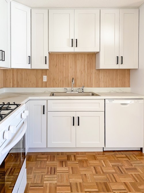 Affordable kitchen cabinets and countertops from CKF transformed our flip kitchen. See our design process, finishes, and budget-friendly tips!