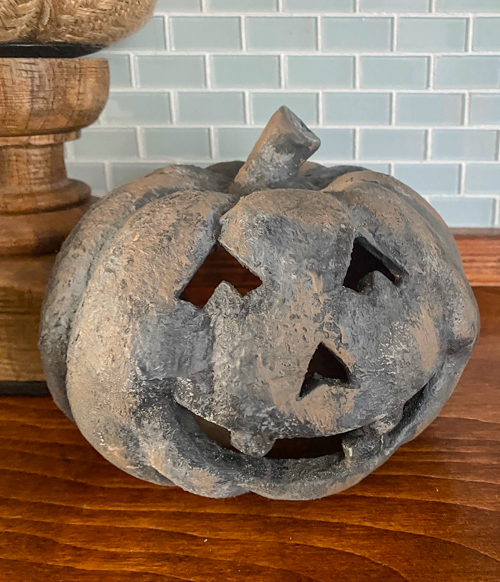 Create a DIY Black Terracotta Jack O’ Lantern Pottery Barn dupe for a fraction of the cost. Easy thrift flip tutorial with supplies and video tutorial.