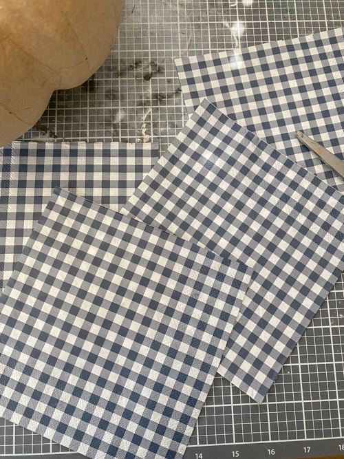 Create cozy fall vibes with this easy DIY Gingham Pumpkin Decor tutorial! Learn how to make budget-friendly gingham pumpkins for your home.