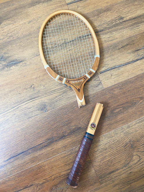 Turn a broken vintage racket into a DIY Tennis Racket Pumpkin! This easy upcycle makes the cutest fall wreath or wall decor for your home.