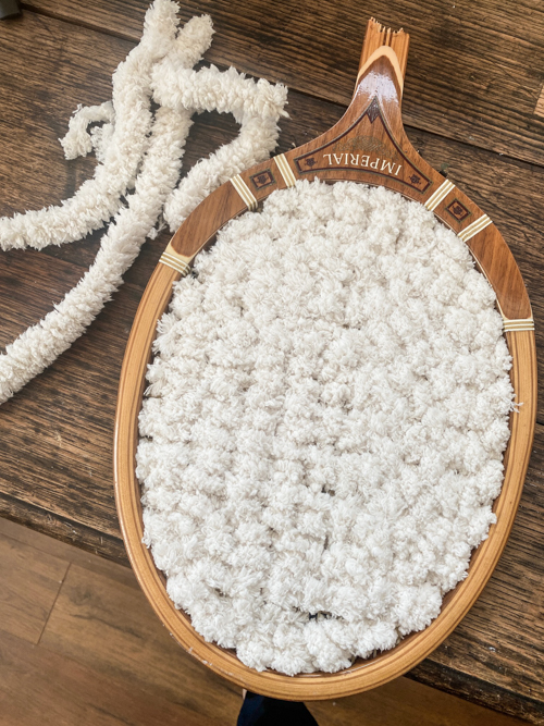 Turn a broken vintage racket into a DIY Tennis Racket Pumpkin! This easy upcycle makes the cutest fall wreath or wall decor for your home.