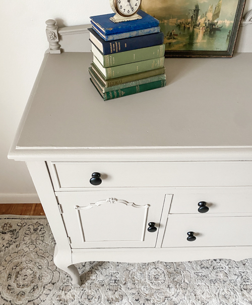 See how this French Country Buffet Makeover turned an outdated piece into a stunning focal point with French Linen paint and black hardware.