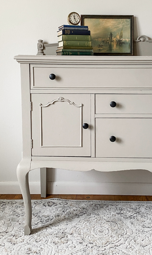 See how this French Country Buffet Makeover turned an outdated piece into a stunning focal point with French Linen paint and black hardware.