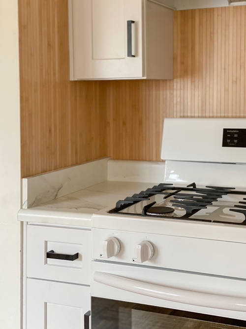 DIY Pole Wrap Kitchen Backsplash tutorial: budget-friendly, tile-free, and easy to install. Transform your kitchen with this simple step-by-step guide.