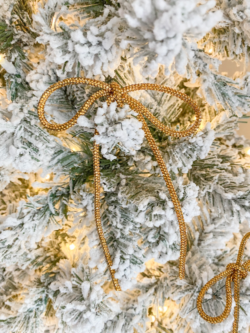 DIY Rhinestone Bow Christmas Ornaments add sparkle and style to your holiday décor. Easy, affordable, and perfect for this year’s trending bow look!