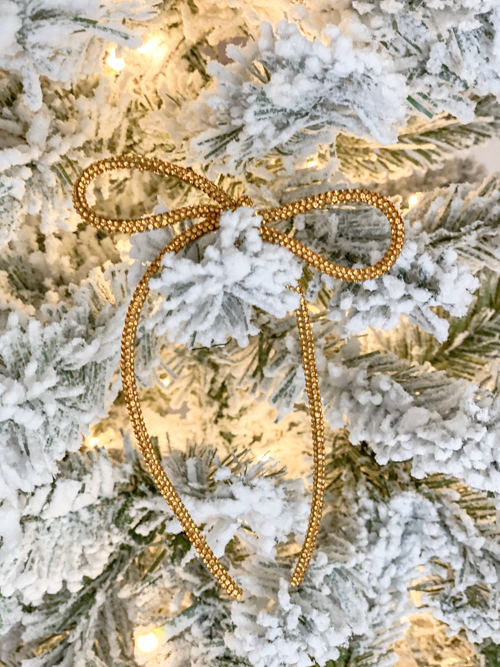 DIY Rhinestone Bow Christmas Ornaments add sparkle and style to your holiday décor. Easy, affordable, and perfect for this year’s trending bow look!