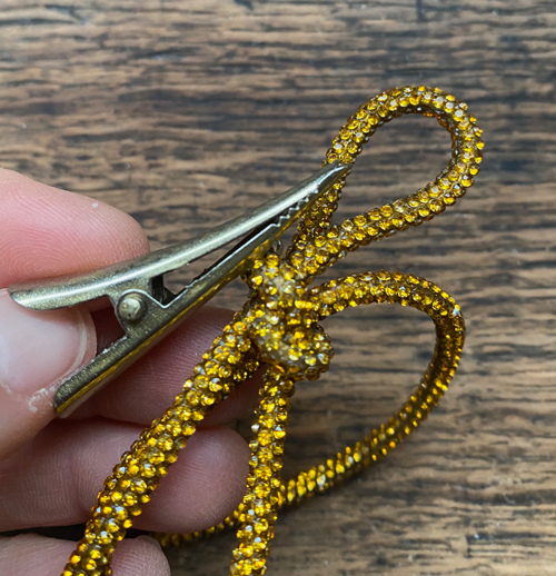 DIY Rhinestone Bow Christmas Ornaments add sparkle and style to your holiday décor. Easy, affordable, and perfect for this year’s trending bow look!