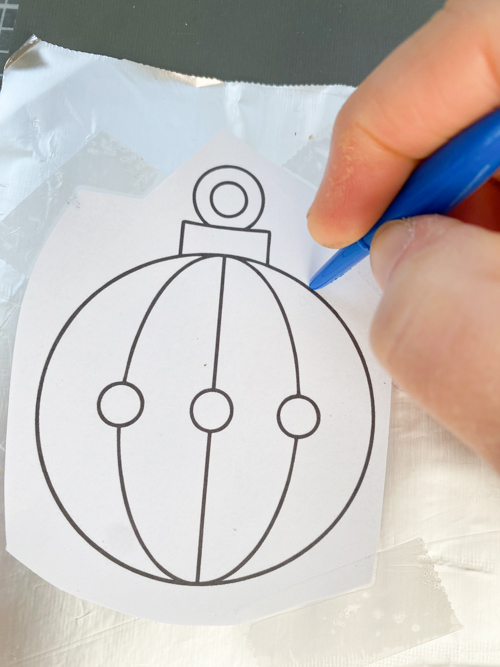 Learn how to make DIY vintage tin ornaments with aluminum foil, cardstock, and paint for a charming, antique-inspired Christmas look.