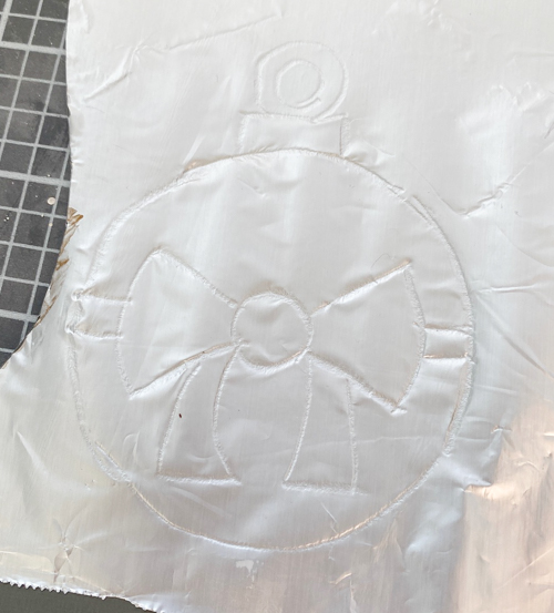 Learn how to make DIY vintage tin ornaments with aluminum foil, cardstock, and paint for a charming, antique-inspired Christmas look.