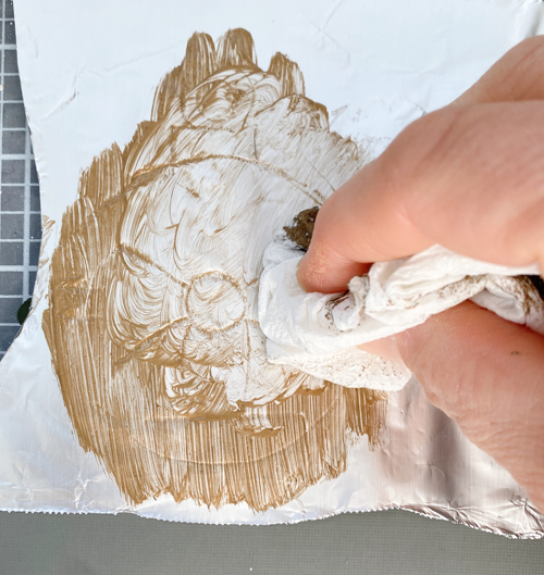 Learn how to make DIY vintage tin ornaments with aluminum foil, cardstock, and paint for a charming, antique-inspired Christmas look.