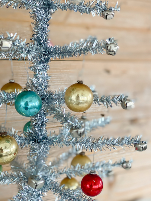Discover how to craft a DIY Vintage Aluminum Christmas Tree with budget-friendly materials. A fun retro project to add sparkle and vintage charm to your holidays.