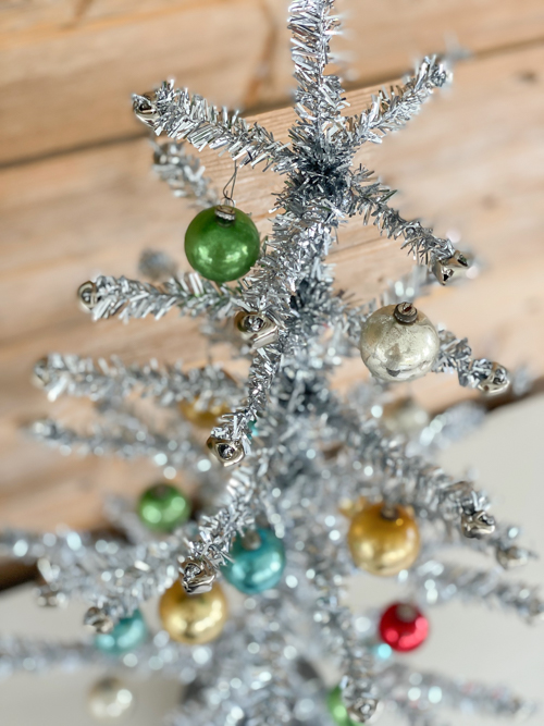 Discover how to craft a DIY Vintage Aluminum Christmas Tree with budget-friendly materials. A fun retro project to add sparkle and vintage charm to your holidays.
