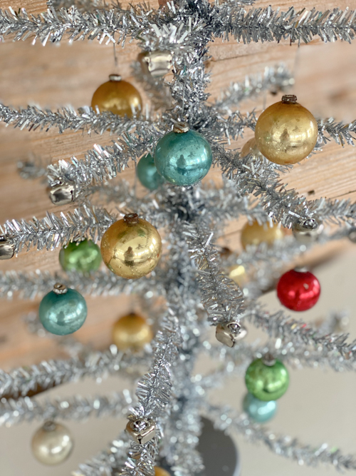 Discover how to craft a DIY Vintage Aluminum Christmas Tree with budget-friendly materials. A fun retro project to add sparkle and vintage charm to your holidays.