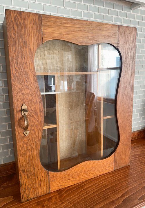 Vintage Wall Cabinet Makeover that shows how a simple back-panel update can refresh the piece while keeping all the original charm and patina.