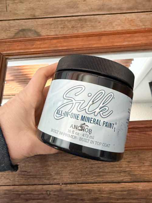 This Black Paint Wash Technique adds age and charm to a thrifted mirror. An easy DIY paint wash that highlights wood grain and character.