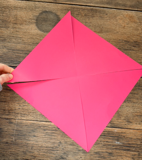 Learn how easy it is to make DIY paper bows with hot glue, paper, and scissors. Make them for birthdays, gifts, Valentine's Day decor, or turn them into garlands.