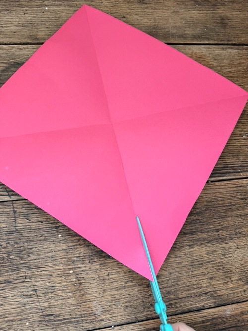 Learn how easy it is to make DIY paper bows with hot glue, paper, and scissors. Make them for birthdays, gifts, Valentine's Day decor, or turn them into garlands.