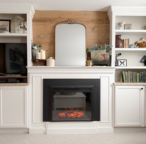 Thinking about an Electric Fireplace Insert Heater? We replaced ours in our family room and share the exact model, fit, and honest review.