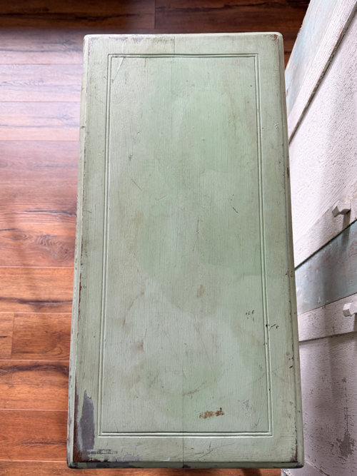 Learn how to remove paint from vintage table surfaces before repainting. Step-by-step tutorial using a heat gun and sanding for best results.
