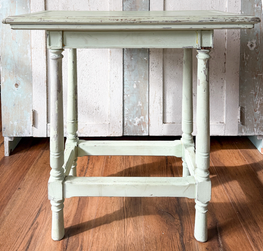 Learn how to remove paint from vintage table surfaces before repainting. Step-by-step tutorial using a heat gun and sanding for best results.