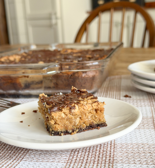 Indulge in these decadent Layered Peanut Butter Brownie Bars with chewy oatmeal, rich chocolate, and gooey peanut butter layers. Perfect for anytime treats!