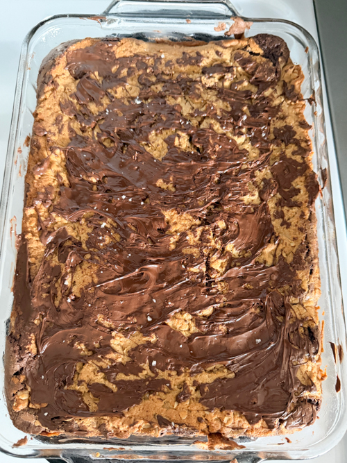 Indulge in these decadent Layered Peanut Butter Brownie Bars with chewy oatmeal, rich chocolate, and gooey peanut butter layers. Perfect for anytime treats!